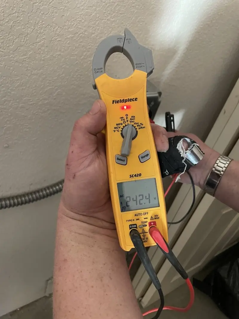 Voltage testing with clamp meter during Outlet Installation in Mantua